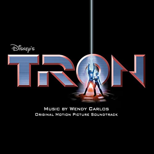 TRON" vinyl record cover featuring blue neon figures and the Disney logo.