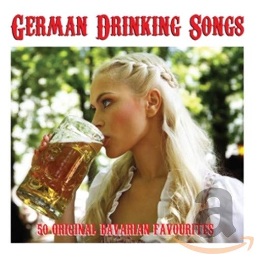 A woman with blonde hair drinks from a large glass beer mug outdoors.