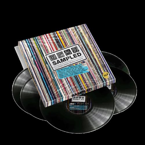 Colorful vinyl record box set with multiple black LPs stacked beneath.