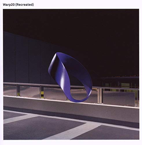 CD cover for “Warp20: Recreated” featuring a blue, abstract ribbon shape.