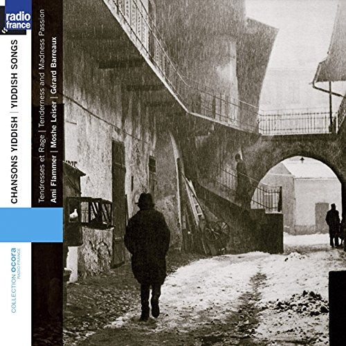CD cover: black and white street scene with a figure walking away.