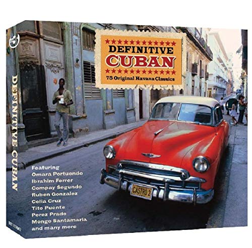 A red vintage car parked on a Havana street with a man standing nearby.