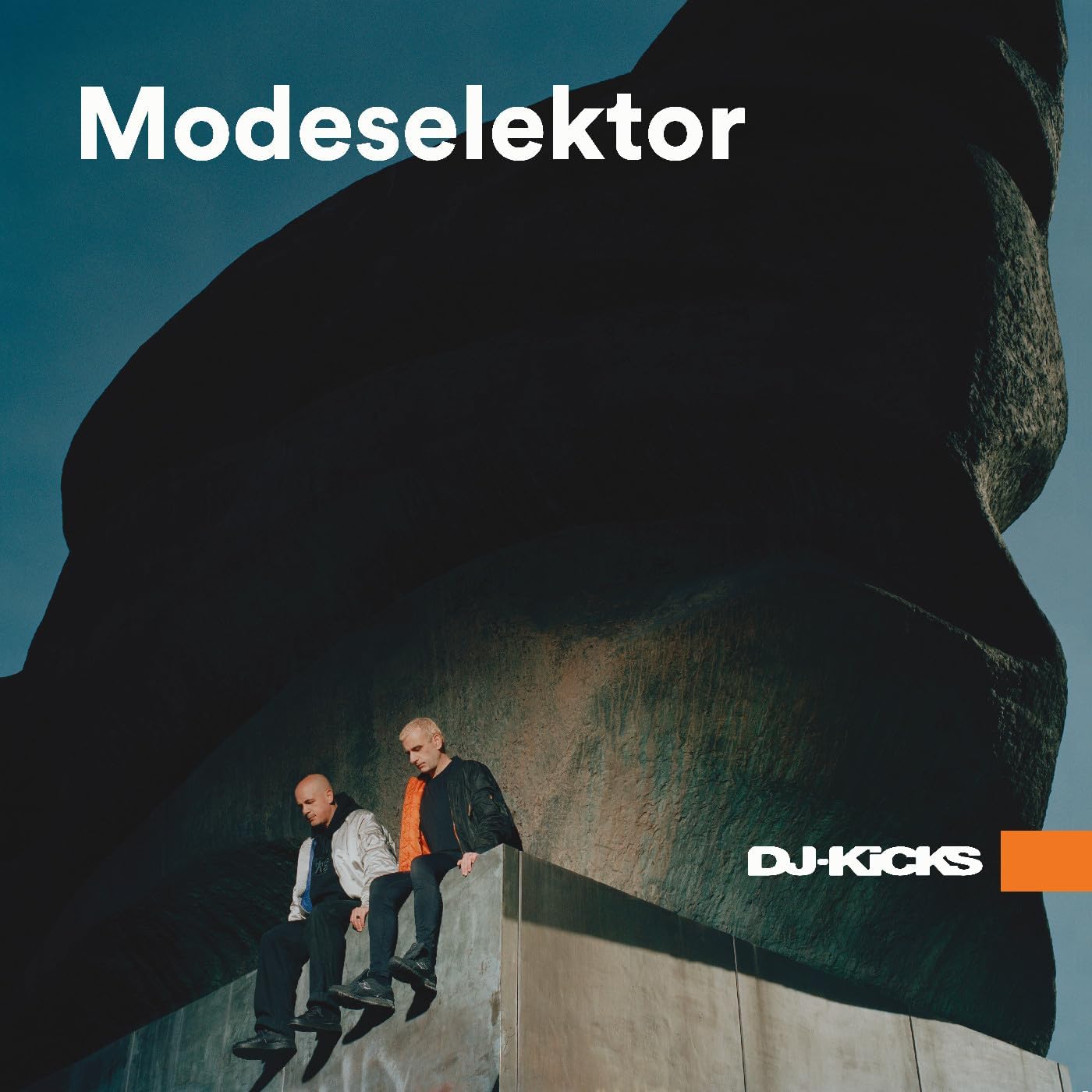 Album cover for Modeselektor’s DJ Kicks, featuring two people seated.