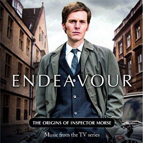 CD cover for “Endeavour” featuring a man in a coat and cityscape.