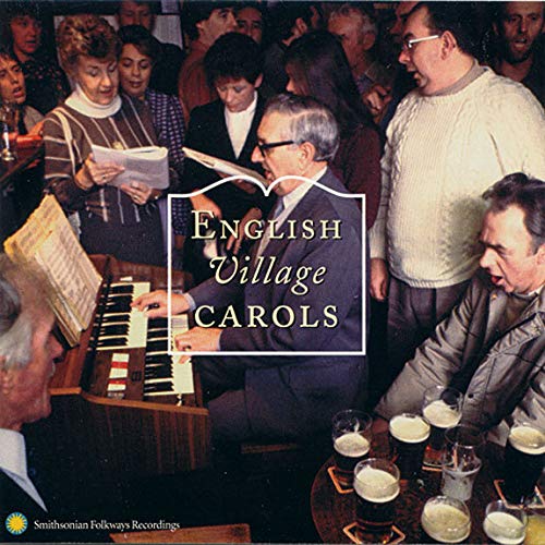 A group of people singing in a pub while a man plays an organ.