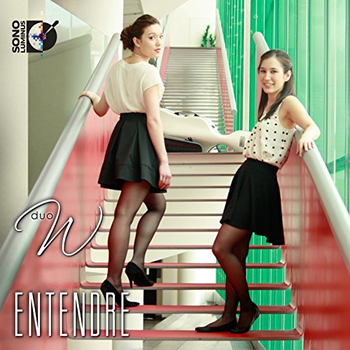 Two women stand on a staircase with red steps and silver railings, facing opposite directions.