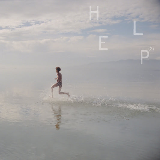 A person runs through shallow water under a cloudy sky with the text HELP(2) above.