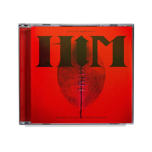 Red CD case for "HIM" soundtrack, featuring large text and a boot shape.