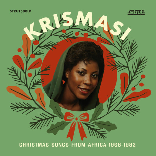 Record album cover featuring a woman’s portrait surrounded by festive greenery.