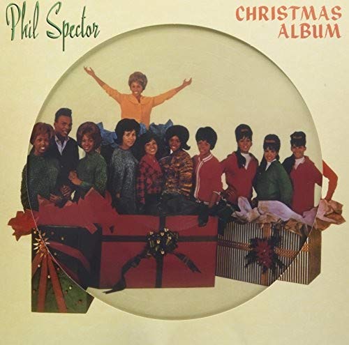 Phil Spector’s “A Christmas Gift for You” album cover with singers and gifts.