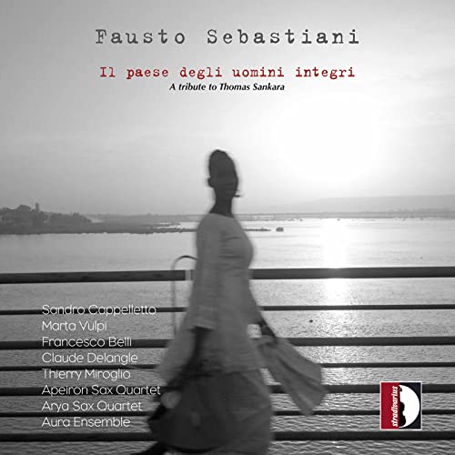CD cover: blurred figure walking towards water, text listing artists.