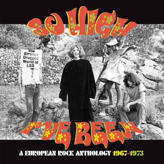 Black and white photo of four people outdoors with psychedelic orange text overlay.