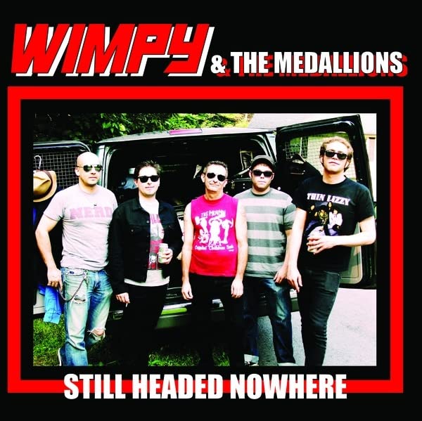 Album cover featuring a band of five people standing in front of a van.