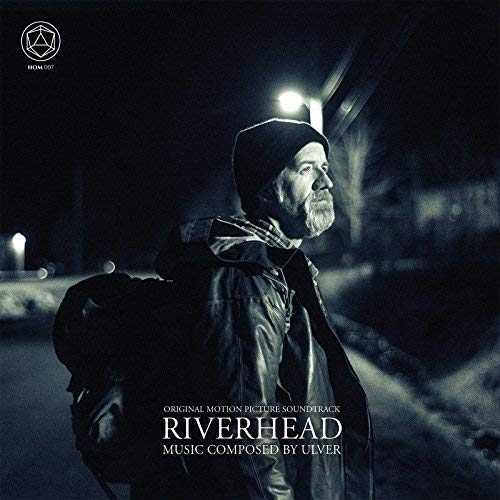 Black and white album cover featuring a bearded man in a beanie and jacket.