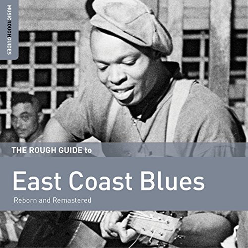 CD cover featuring a smiling blues musician playing guitar.
