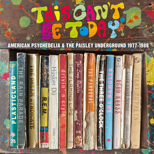 Album cover showing a row of vintage book spines against a paint-splattered wooden background.