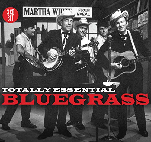 Black and white photo of a bluegrass band performing with instruments on stage.