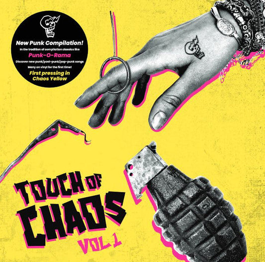 Yellow vinyl record cover with hand, rings, and grenade imagery.