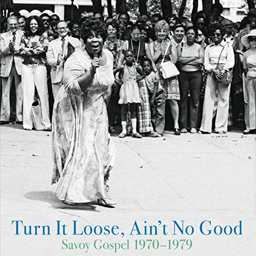 Black and white album cover with a woman dancing in front of a crowd.