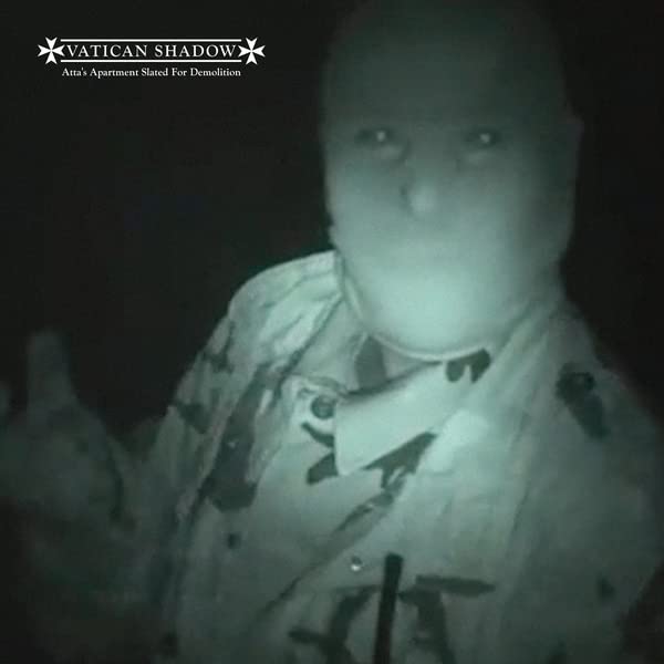 Dark, grainy image of a baby’s face with the album title overlayed.