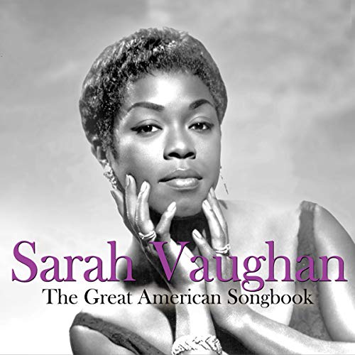 Black and white portrait of Sarah Vaughan with hands near her face.