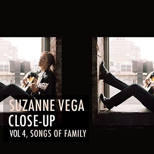 Suzanne Vega sitting and playing guitar, album cover art.
