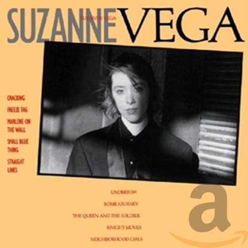 Album cover for Suzanne Vega featuring a black and white portrait on orange background.