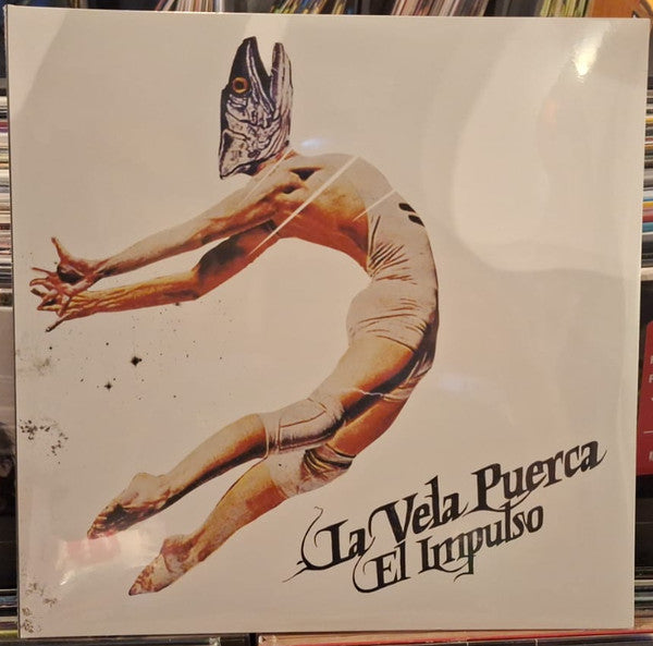 Album cover for Vela Puerca’s “El Impulso” featuring a leaping figure.