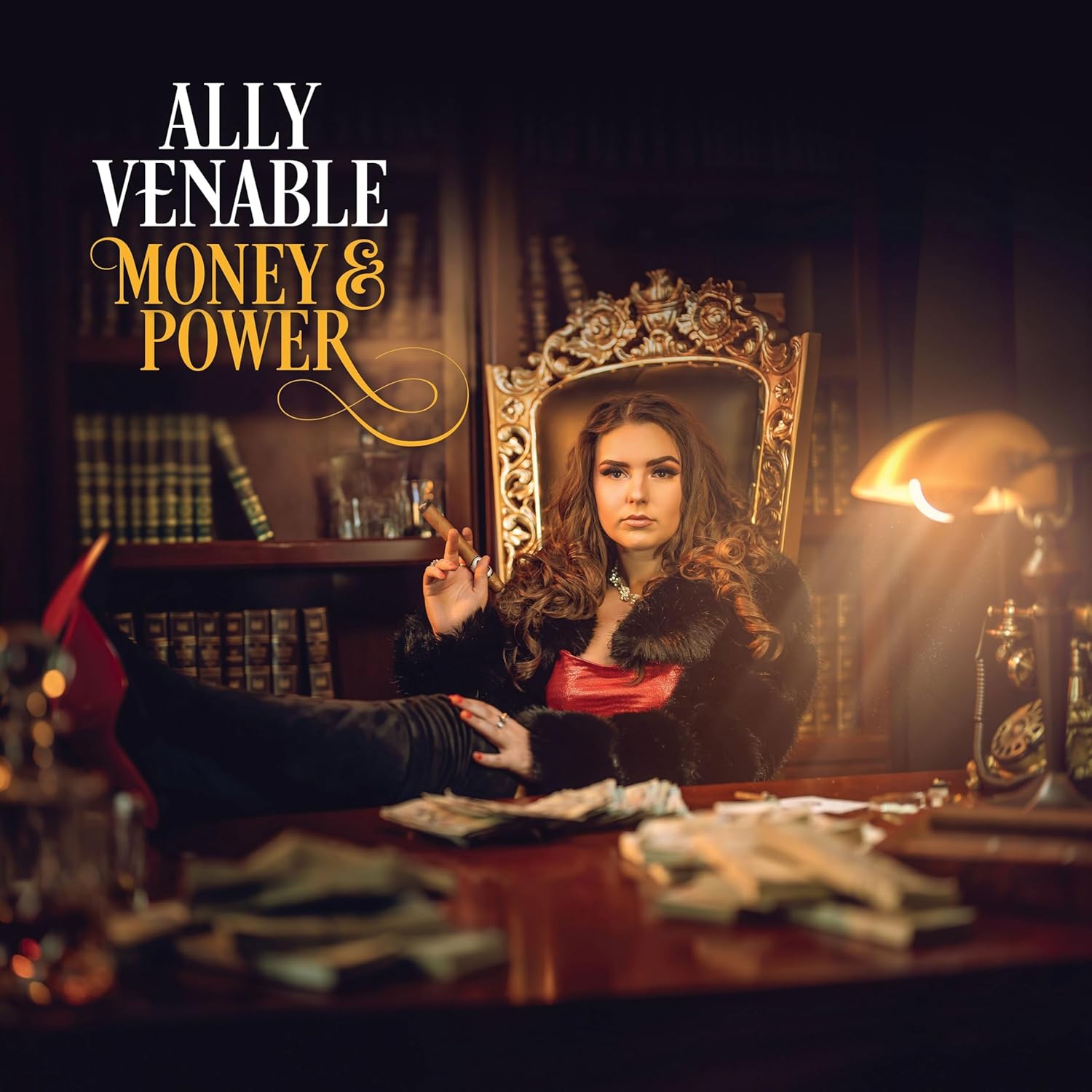 Ally Venable sits in a chair with feet on a desk covered in cash.