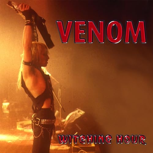 A musician holding a guitar aloft on stage with the text Venom Witching Hour.