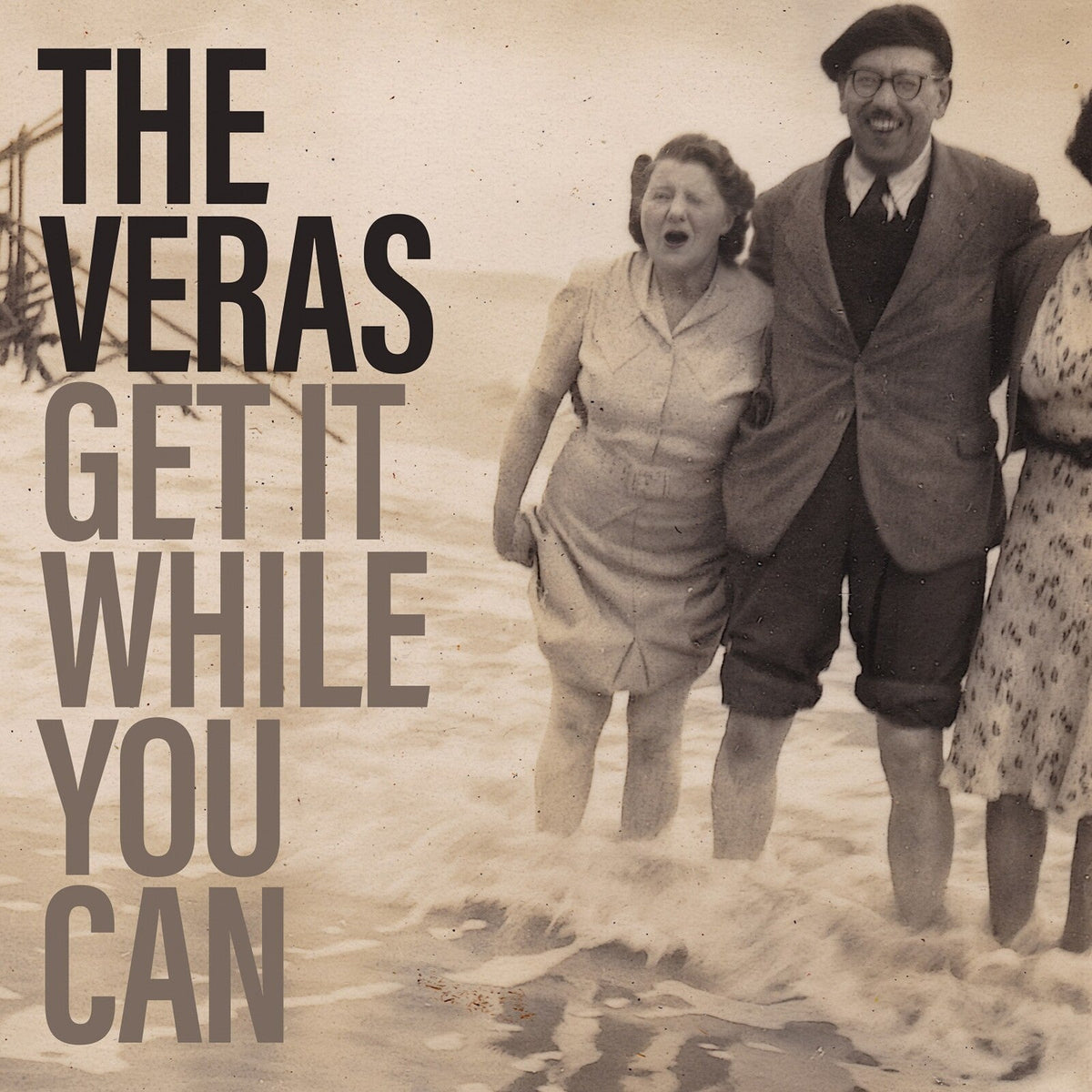 Vintage photo of people running on a beach, with bold text overlay.