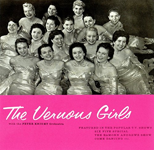 Black and white photo of a group of smiling women in gowns.
