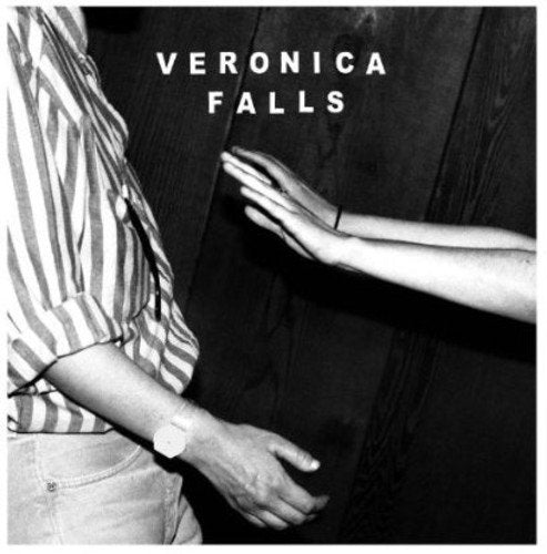 Black and white album cover with people’s arms and hands reaching.