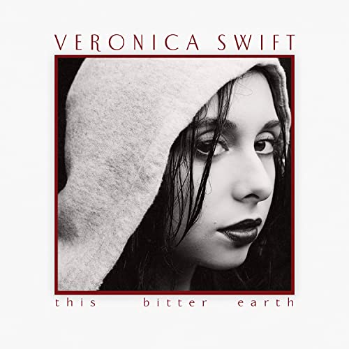 Black and white portrait of Veronica Swift with a hooded cowl.
