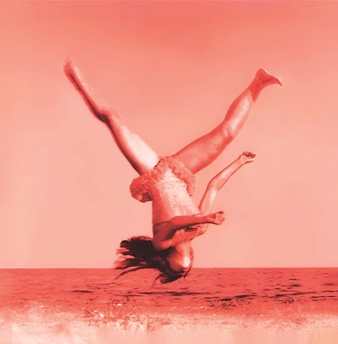 A person in a tutu performs a backflip against a solid coral-red background.