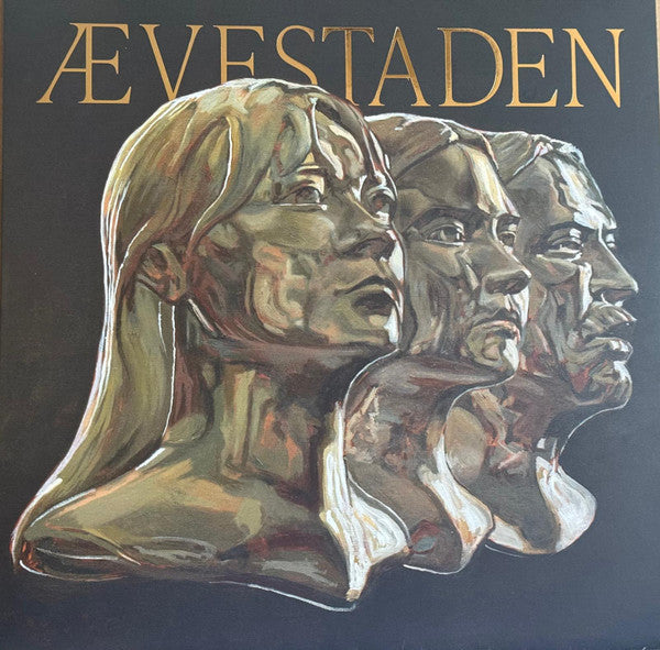Vinyl record cover featuring three overlapping portraits in gold tones.