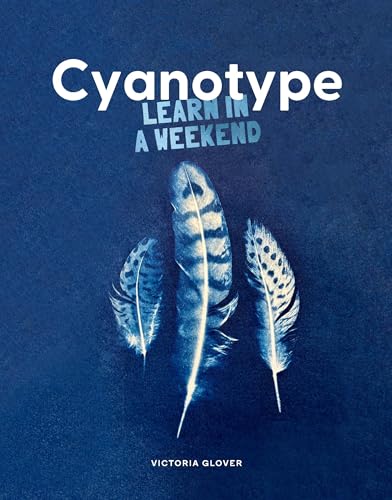 Book cover titled Cyanotype featuring three white bird feathers against a dark blue background.