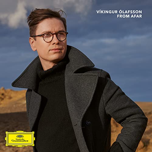 Víkingur Ólafsson album cover: man in coat, glasses, landscape background.