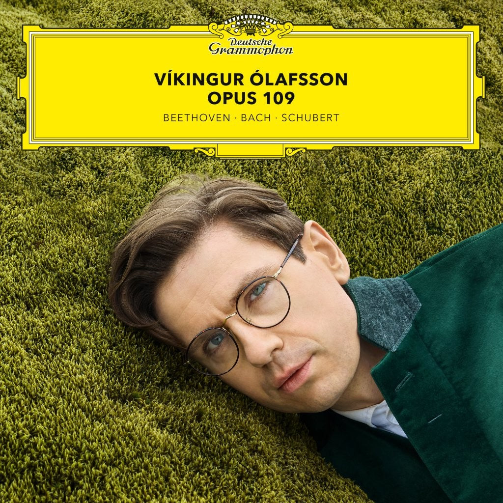 Vinyl album cover featuring pianist Víkingur Ólafsson lying in green grass.