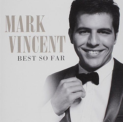 Black and white CD cover featuring a smiling man in a tuxedo.