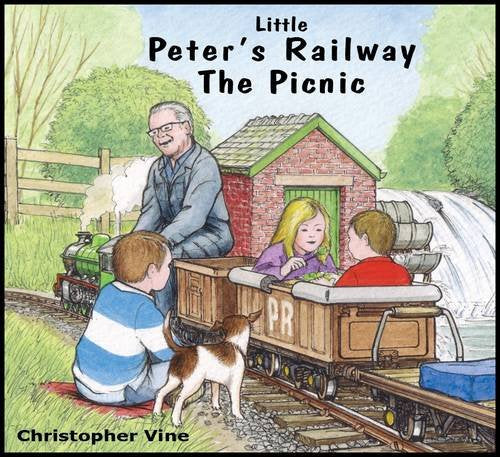 Children, a dog, and an older man beside a miniature railway and station.