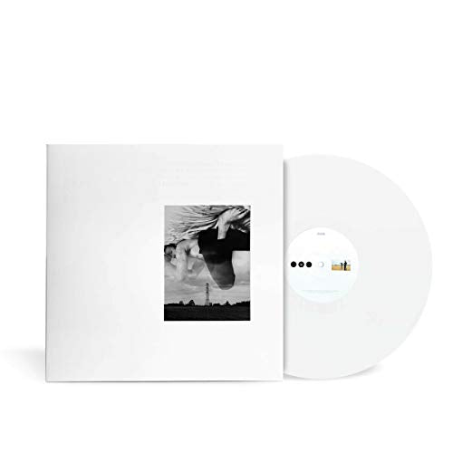 White vinyl record with black and white album cover featuring a figure.