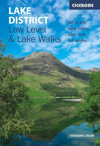 Book cover showing a mountain reflected in a lake with blue sky and clouds.