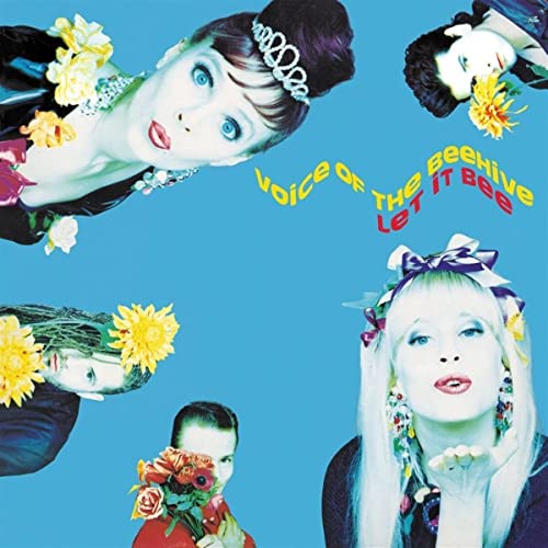 Album cover with four band members on a blue background and yellow text.