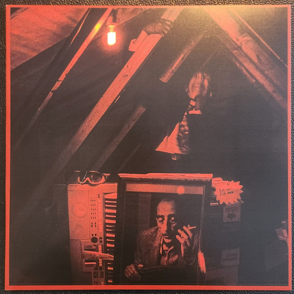 Red-toned vinyl record cover featuring a portrait of a man smoking.