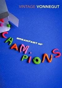 "Green cereal box with 'Breakfast of Champions' text and Kurt Vonnegut's name on the front."