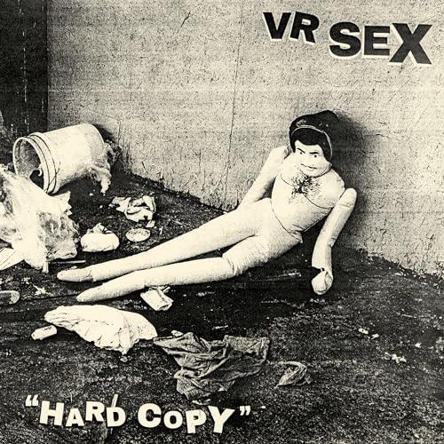 Black and white album cover with a doll leaning against a wall.