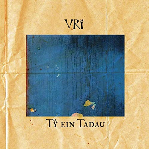 "Album cover with blue rectangle on aged, crumpled paper background, titled 'VRi - Ty Ein Tadau'."