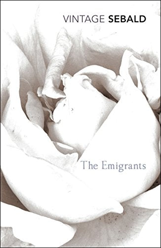 Book cover of "The Emigrants" by W.G. Sebald with industrial cityscape and circular images.