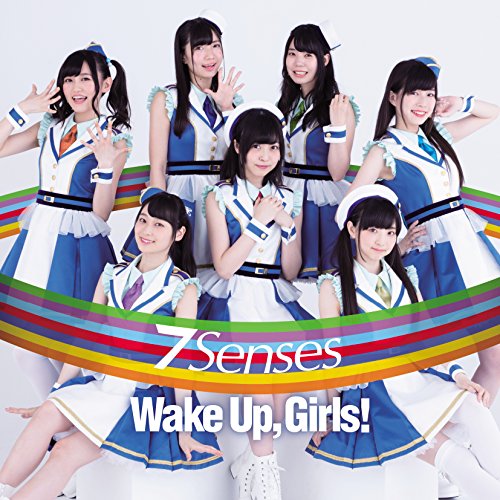 Seven young women in matching blue and white outfits pose against a white background.